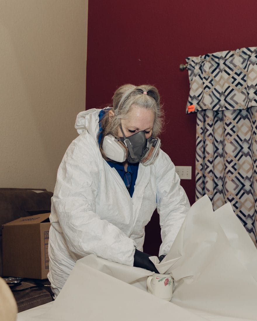 A Superior Contents technician wrapping and boxing belongings on site