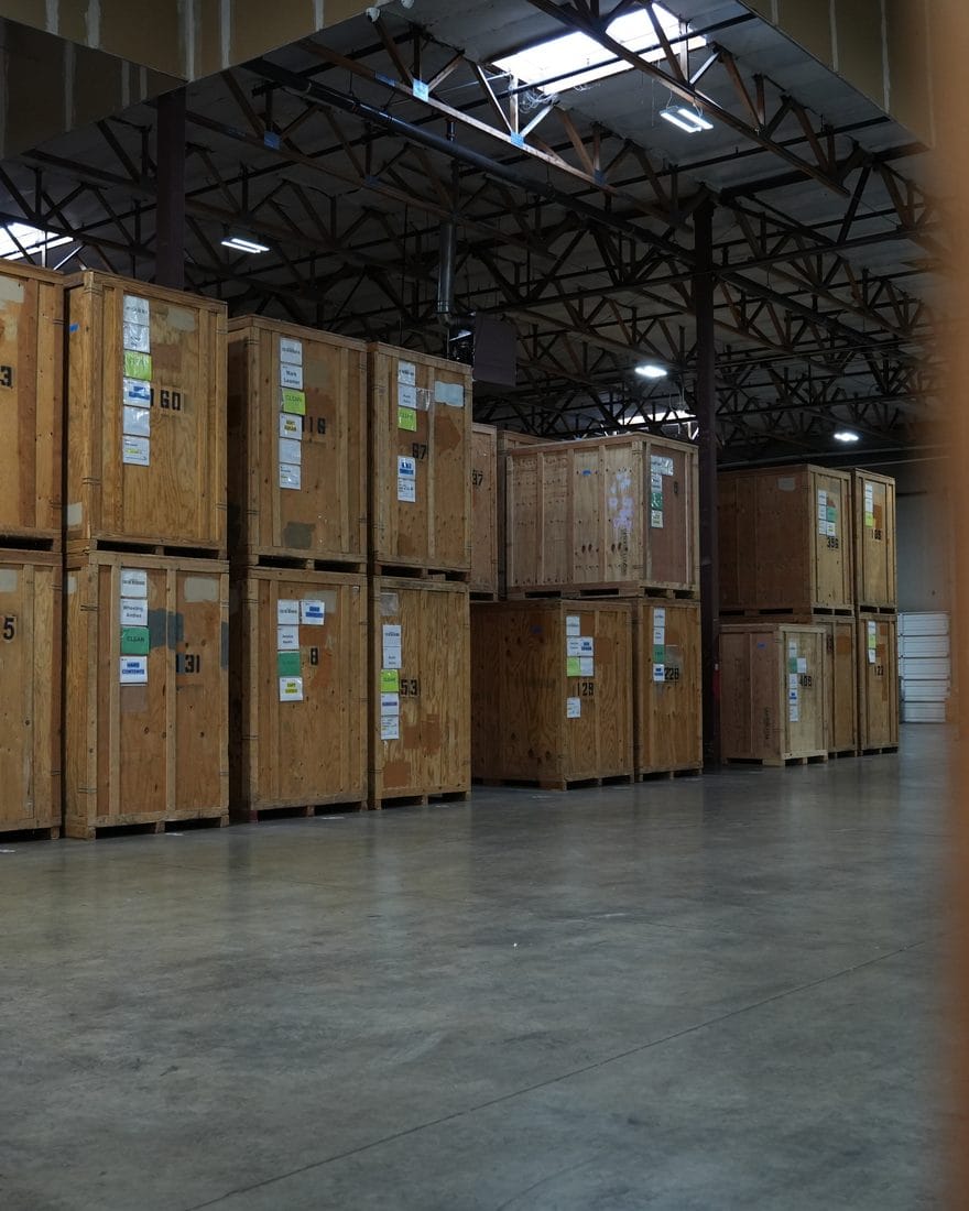 Labeled wooden storage vaults inside the Superior Contents facility